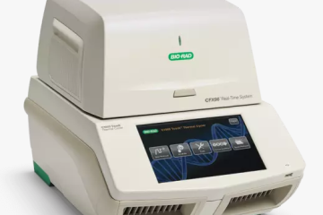 An off-white, cube shaped device, the Bio-rad CFX96 qPCR machine, sits on a white background