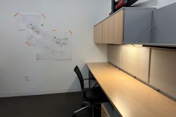 Empty modern desk with monitor reflecting the PodA hotel desk