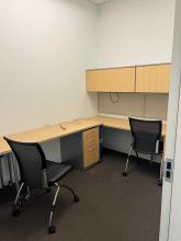 Distant view of desk area with cubbies